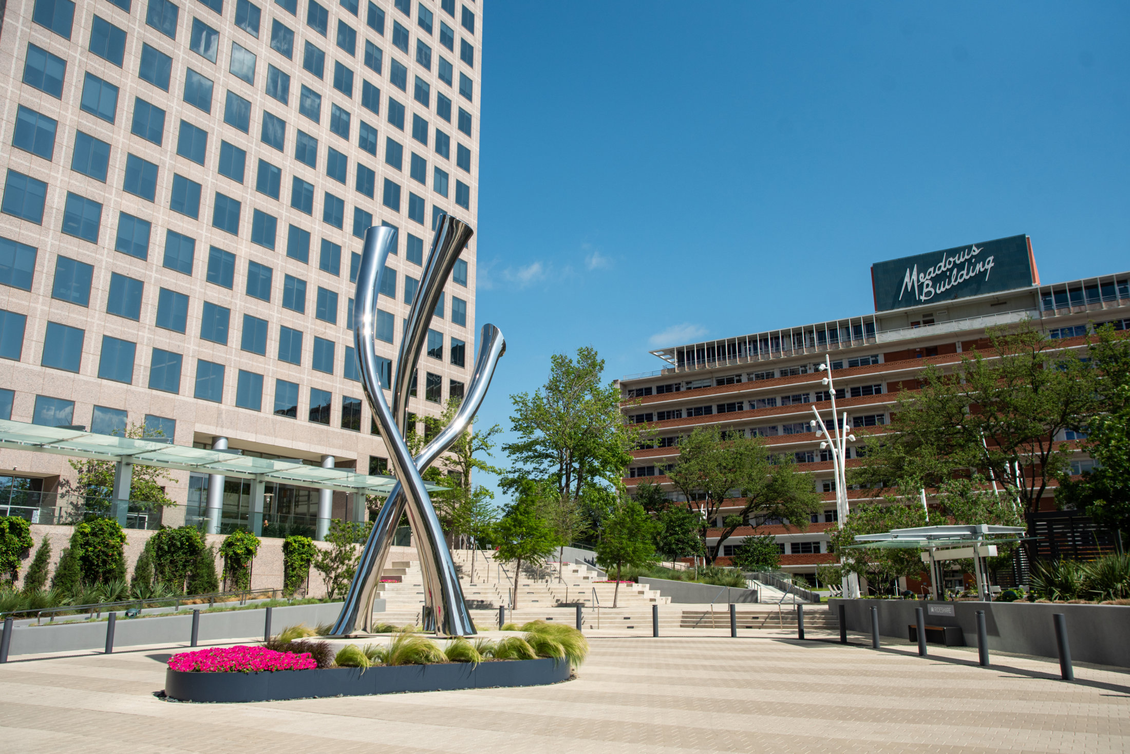 Corporate plaza with sculpture and seasonal plantings